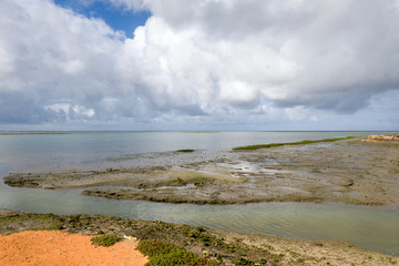 old salt marsh taken up by the sea in Olhao, Algarve, Portugal