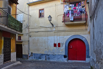 Fototapeta premium Teano, Italy, 11/30/2019. A street among the old houses of a medieval village