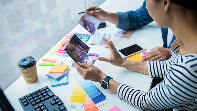 Advertising agency designer creative start-up team discussing ideas in office.