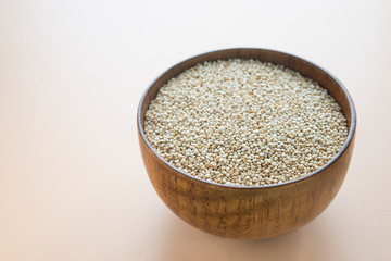 White Quinoa Seeds in wooden bowl