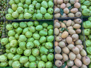 Big pile of guava and sapote fruit at famers' market