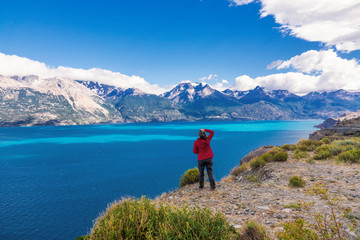 Fototapeta na wymiar Woman tourist hiking, Chile travel, Bertran lake and mountains beautiful landscape, Chile, Patagonia, South America