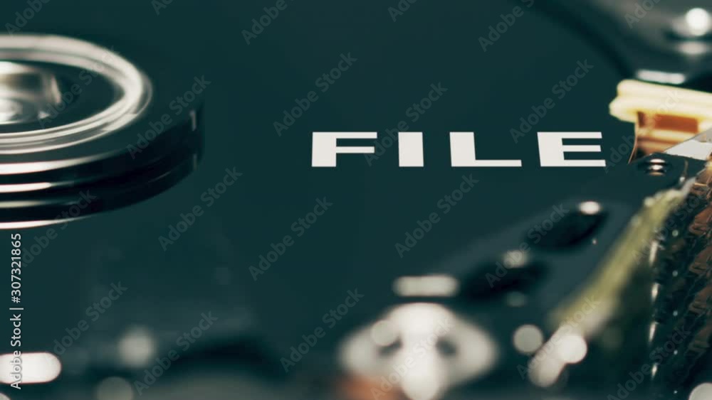 Poster moving head of computer hard disk drive reveals file text