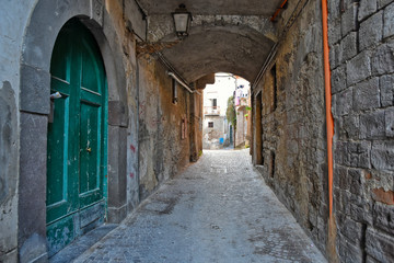 Fototapeta premium Teano, Italy, 11/30/2019. A street among the old houses of a medieval village