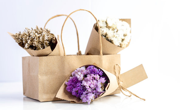 Beautiful Dried Flower Bouquet Wrapped With Kraft Paper In Paper Bag.