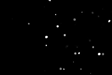 Texture of falling snow, volumetric snow bokeh on a black background