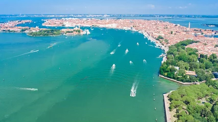 Fotobehang Venetian lagoon and cityscape of Venice city aerial drone view from above, Italy © Iuliia Sokolovska