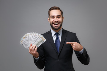 Laughing young business man in suit shirt tie posing isolated on grey background. Achievement...