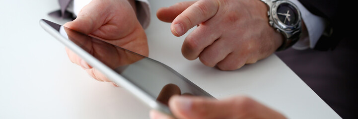 Hand of businessman in suit filling