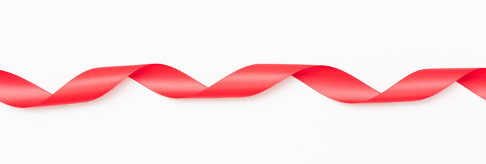 Curly red ribbons on white background