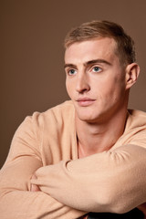 Close up portrait of handsome young man posing in studio