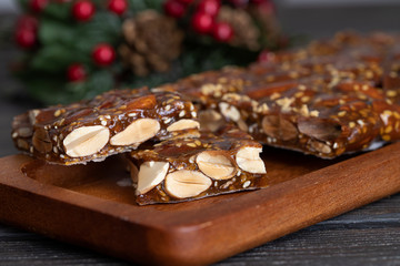 Turron guirlache, Hard nougat made with almond and caramel. Traditional Christmas sweet consumed in Spain.