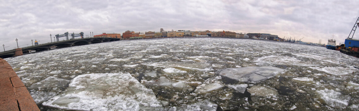 Broken ice at city river