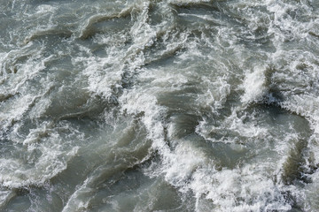 Surface of the mountain creek at day time.