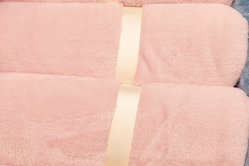  Rolled pink fluffy fur plaids. Copy space. Flat lay.