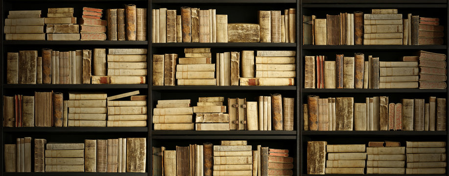 antique books on old wooden shelf.