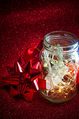 Christmas ornaments on red background with lights like stars