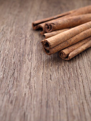 Cinnamon stick on wooden background.