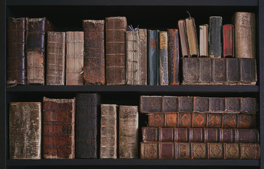 old books on wooden shelf.