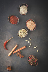 Fototapeta na wymiar Wooden table of colorful spices. Top view