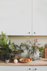 Festive kitchen in Christmas decorations. Christmas dining room. Beautiful New Year decorated classic home interior. New Year and Christmas background