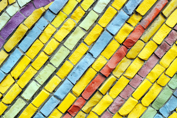 texture of multi-colored stones. Background from vintage mosaic on the wall.