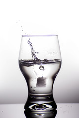 Glass with water isolated on a white background