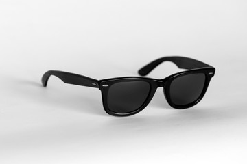 Black classic sunglasses view on white background.Wayfarer sunglasses.