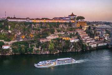 scenery by douro river in porto, portugal at dusk