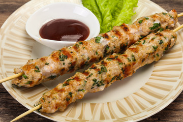 Minced pork skewer kebab with sauce