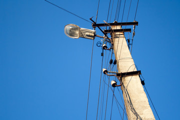electric pole light against blue sky