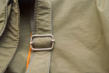 Detail part of Luxury clasp (Buckle) on strap of a ladies new ladies denim jeans clothing accessories. Women fashion background design. Western style. Extreme close up. Selective focus. Copy space