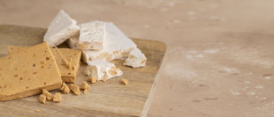 Two types of Turron or hard and soft  almond nougat. Traditional Christmas sweet consumed in Spain.Large image for banner with copy space
