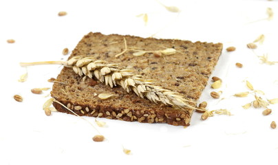 Slices of wholemeal dark bread isolated on a white background in close-up (high details)