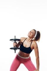 young woman exercising with dumbbells
