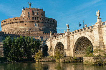 Fototapeta premium Rome, Italy - October 9, 2019 - view of the sculptures of angels and the castle of the Holy Angel on a background of blue sky