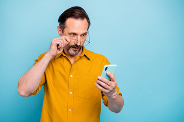 Omg incredible news. Astonished man use smartphone read social network information cant believe his...