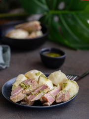 .Famous Canarian dish Papas con Costillas (Ribs and potatoes), served with mojo verde (green souse).It is authentic local food of Canary islands. .