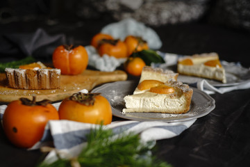 Fototapeta na wymiar Beautiful persimmon cheesecake. Thanksgiving concept.