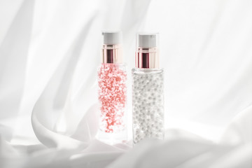 Skincare serum and make-up primer gel bottle, moisturizing lotion and lifting cream emulsion,...
