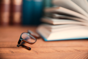 glasses and book on desk