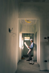 Fototapeta premium Asian engineer is working on construction site.