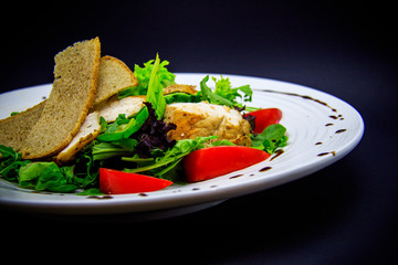 Caesar salad on black background