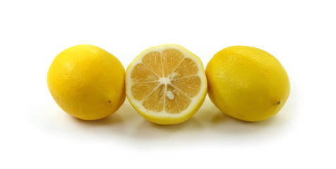 Heap of lemon. Juicy yellow slice of lemon on a white background isolated. Cut lemon fruits isolated on white background.