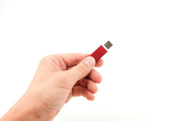 hand holding usb flash drive on white background with copy space