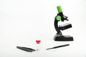 children's microscope with accessories on a white background