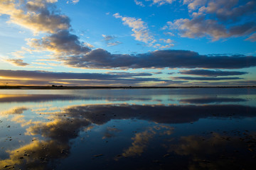 Mirror like reflection in the calm waters of Lake Tyrrell, a salt lake in the Mallee region of Victoria, Australia.