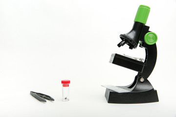 children's microscope with accessories on a white background