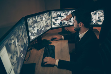 Profile side view of his he qualified safeguard private property expert supervising panel using...