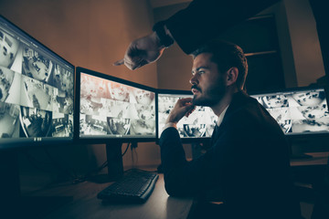 Profile side view portrait of nice attractive serious safeguard supervising alarm panel night shift top manager pointing at screen situation solving at workstation workplace